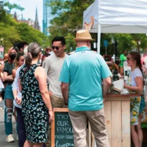 People at vendor table at Open Newbury