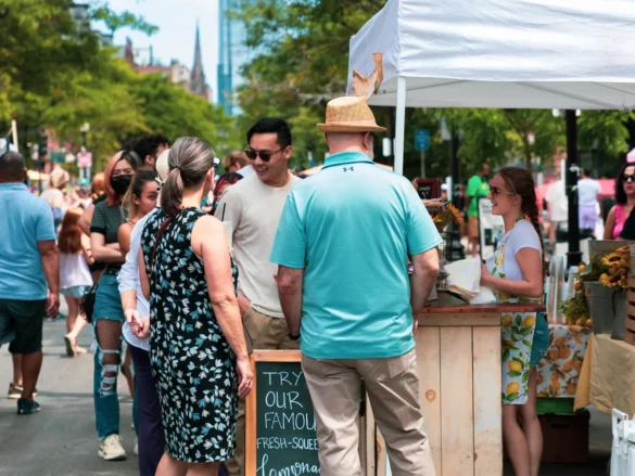 People at vendor table at Open Newbury
